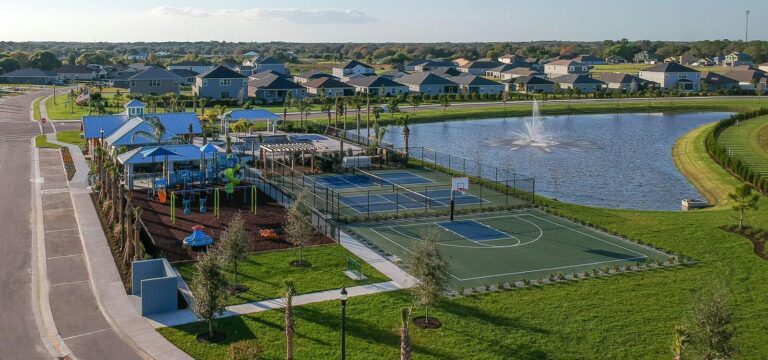 Lakefront amenity center with pool, pickleball and basketball courts at Aviary at Rutland Ranch, Parrish, Florida