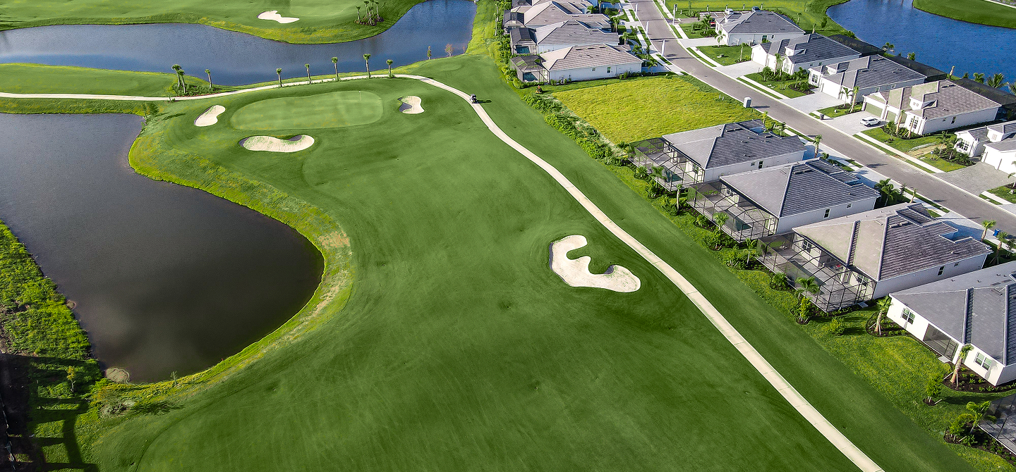 Aerial view of a golf hole, lakes and homes at Calusa Country Club at Lakewood Ranch, Lakewood Ranch, Florida