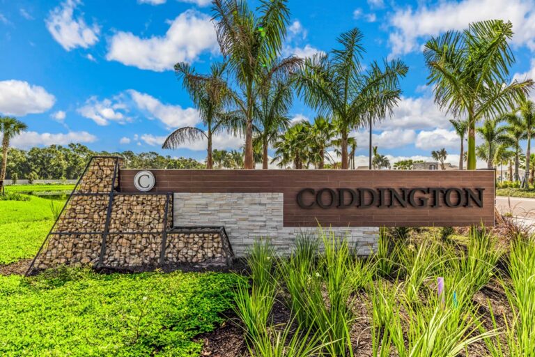 Coddington entrance monument with palms at Coddington, Bradenton, Florida