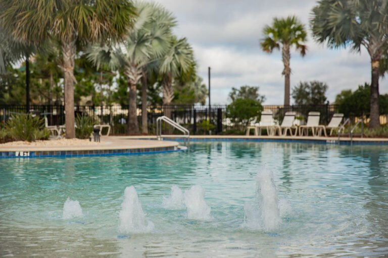 Community pool with fountains and palms at Del Tierra, Bradenton, Florida