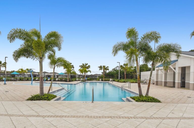 Resort-style pool and splash area beside the clubhouse at Isles at BayView, Parrish, Florida