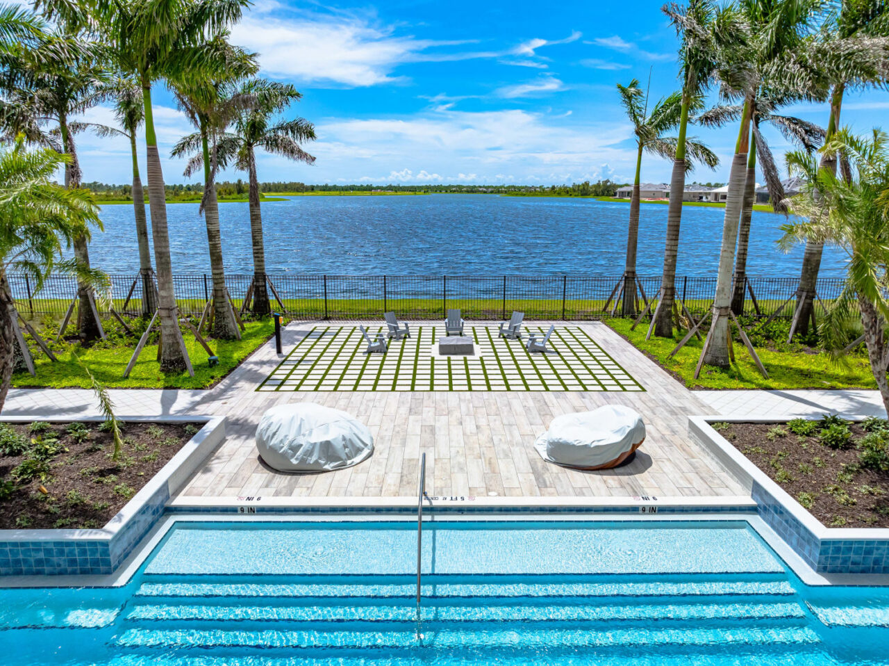 Resort-style pool and lakeside fire pit terrace at Everly, Venice, Florida