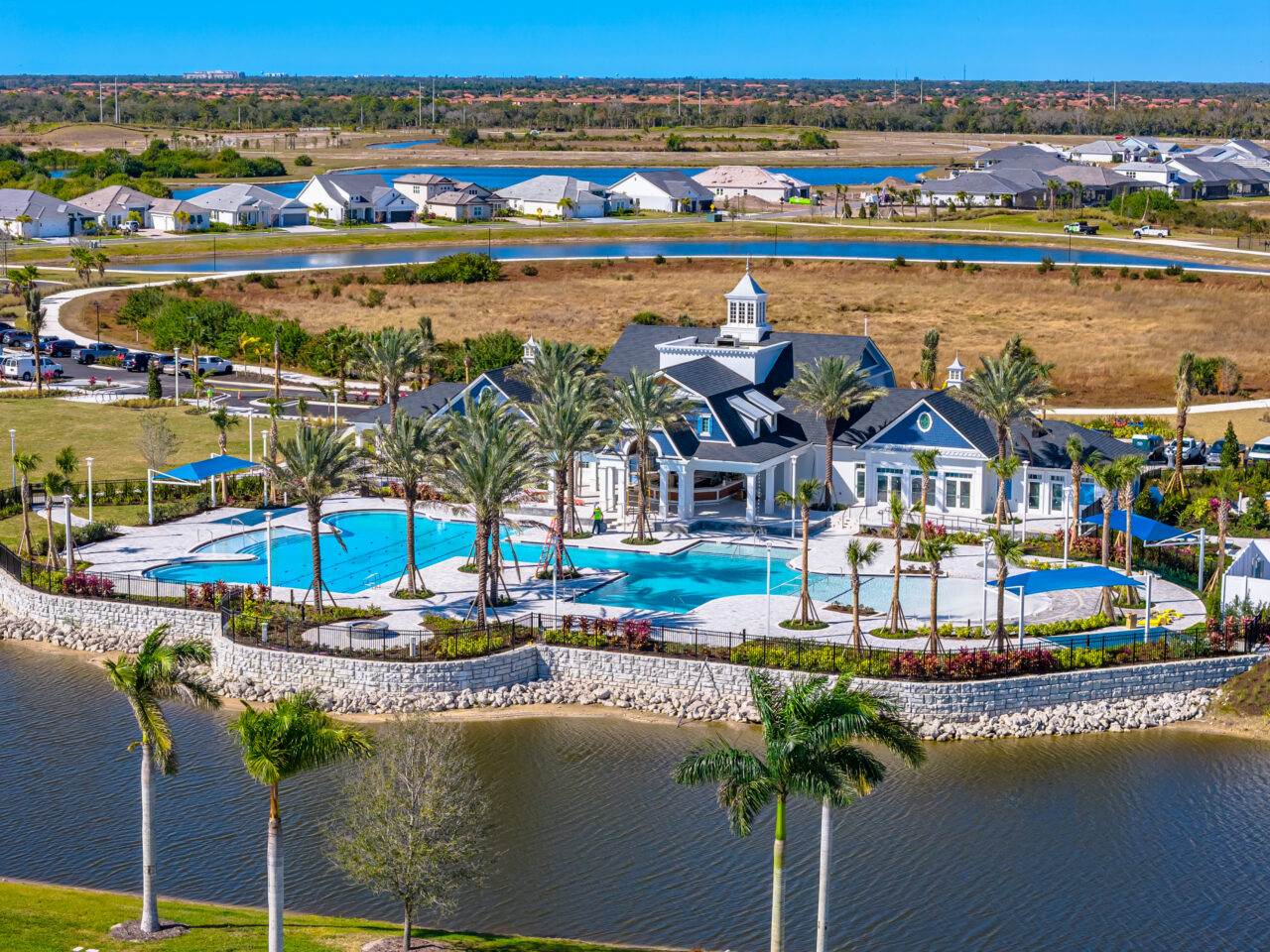 Aerial view of the clubhouse and resort pool on the lake at Palmera, Venice, Florida