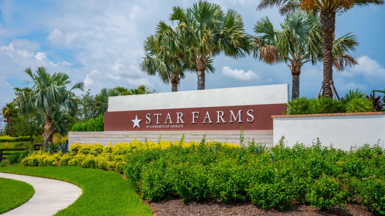 Star Farms at Lakewood Ranch monument sign with palms at Star Farms at Lakewood Ranch, Lakewood Ranch, Florida