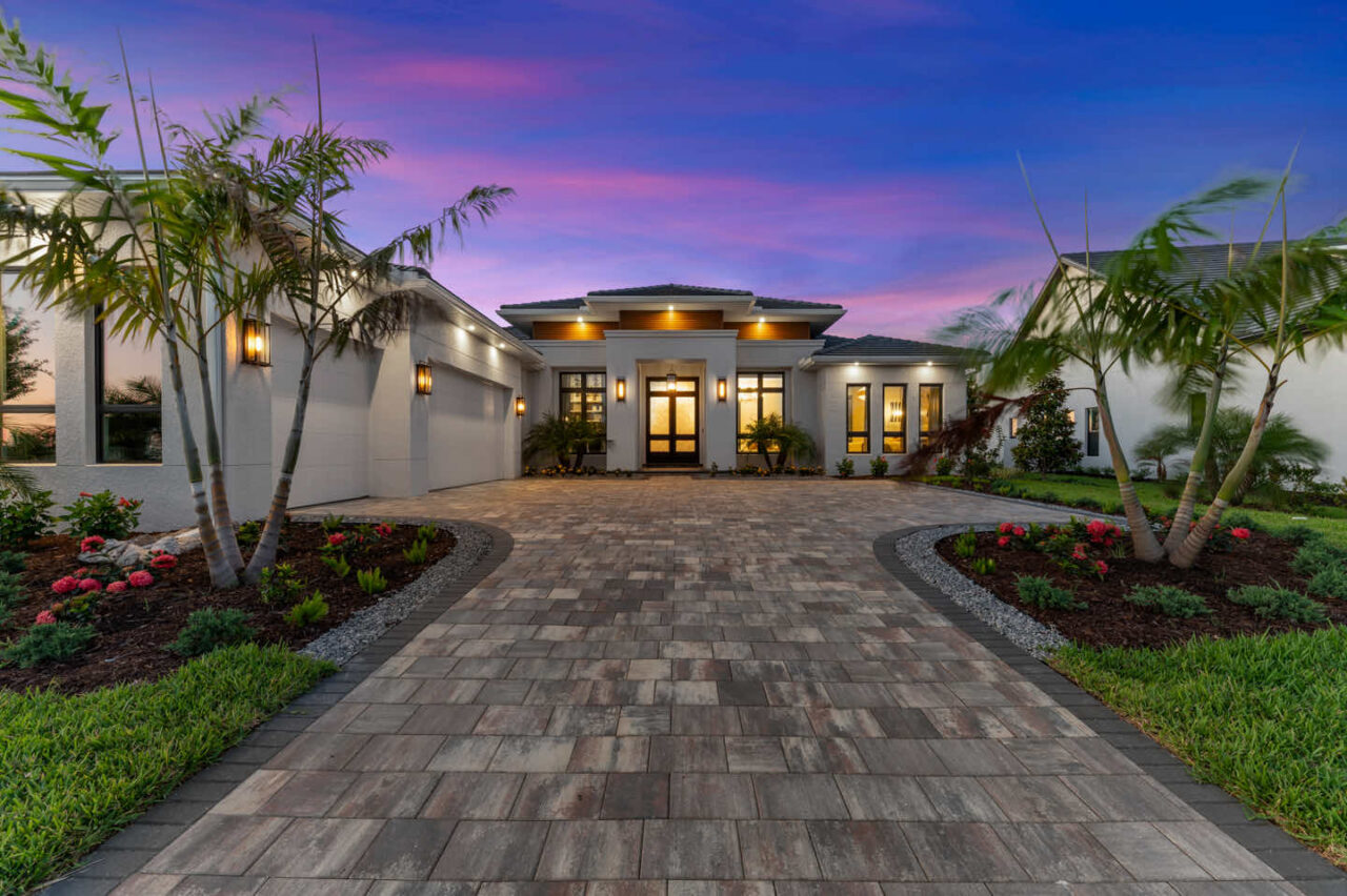 Solstice III model home exterior at dusk at Everly at Wellen Park, Venice, Florida