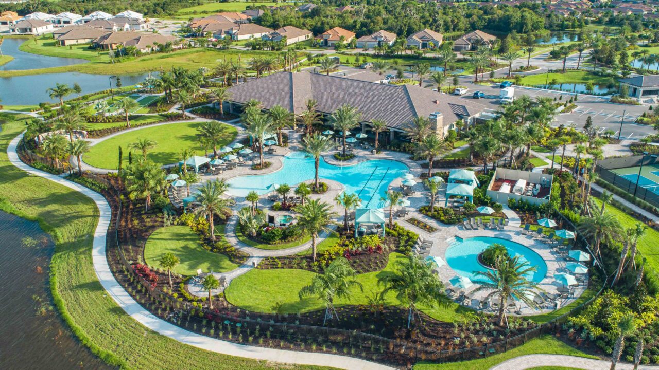 Aerial view of the amenity center and resort pools at Esplanade at Artisan Lakes, Palmetto, Florida