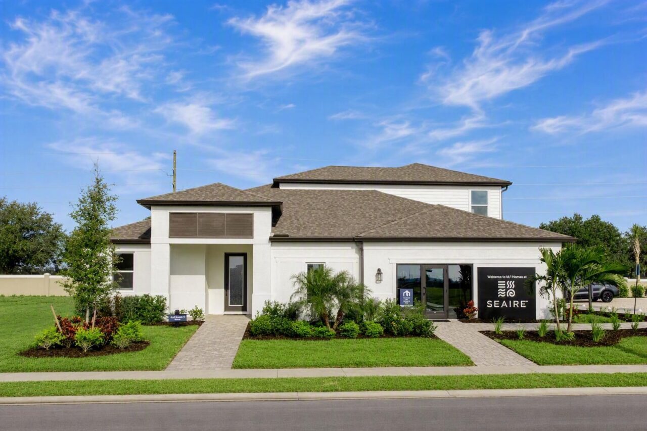 M/I Homes model home with Welcome to M/I Homes at Seaire sign at Seaire, Parrish, Florida