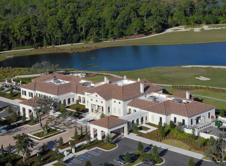 Aerial view of the clubhouse, lake and golf course at The Concession, Bradenton, Florida