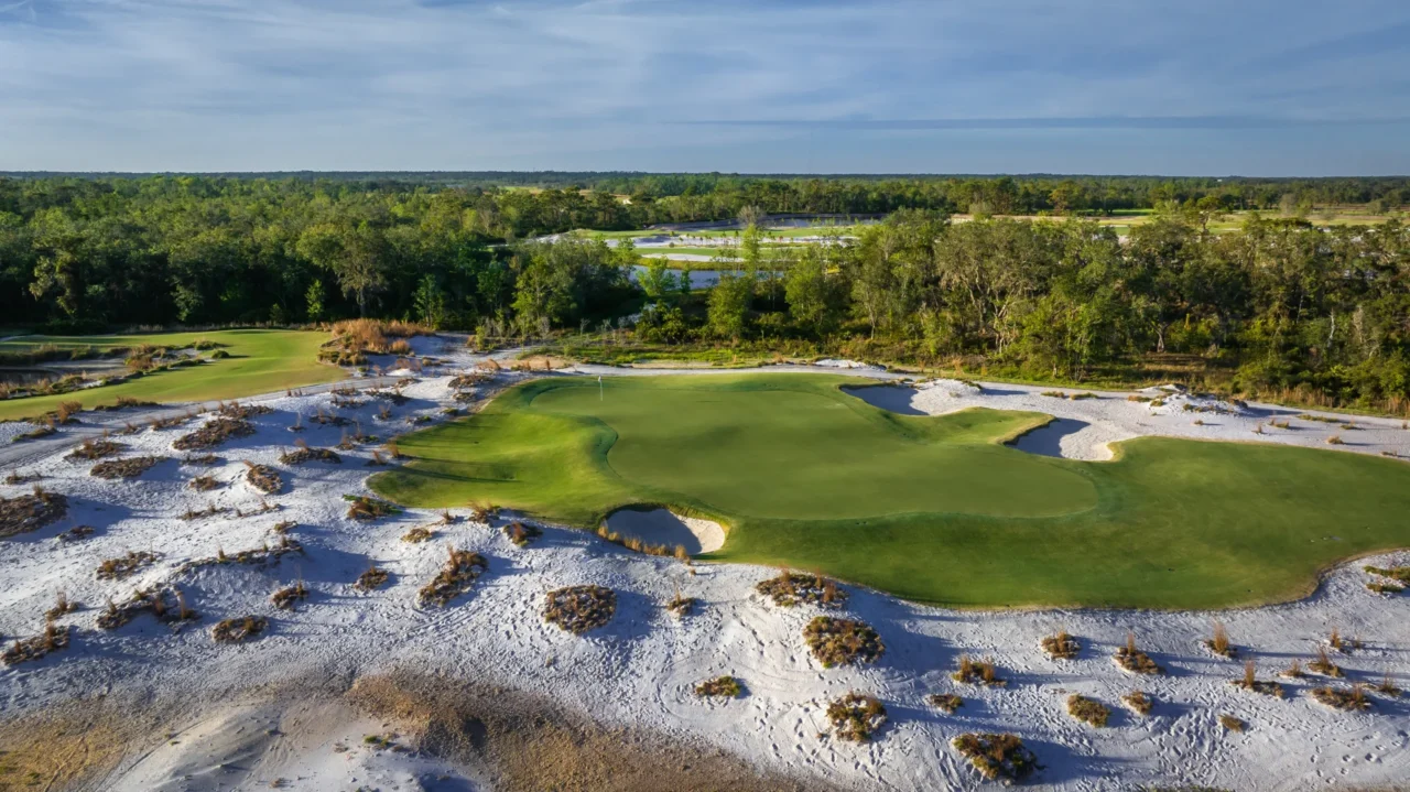 Golf green framed by native sand areas and woods at Soleta Golf Club, Myakka City, Florida