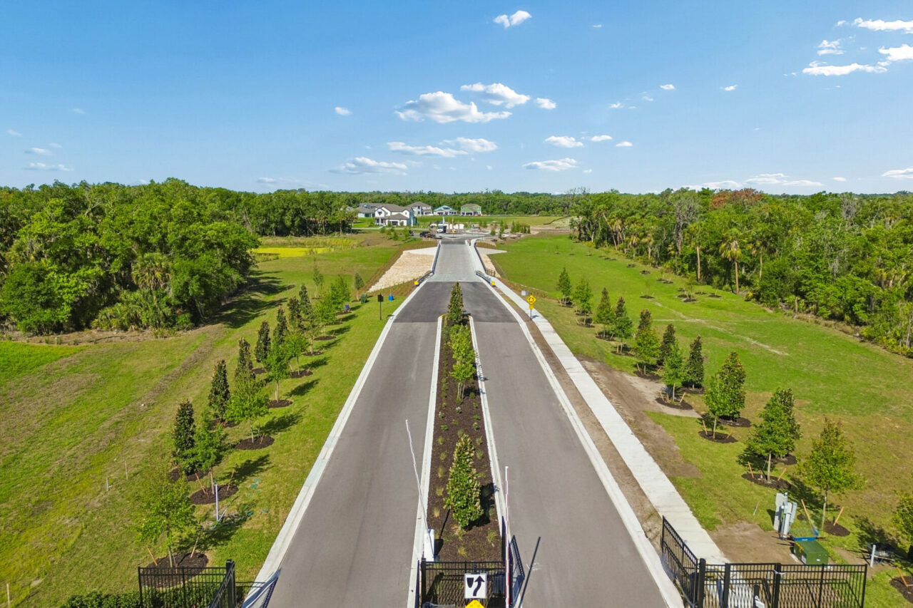 Gated tree lined entrance drive at Creeks Edge at Twin Rivers, Parrish, Florida