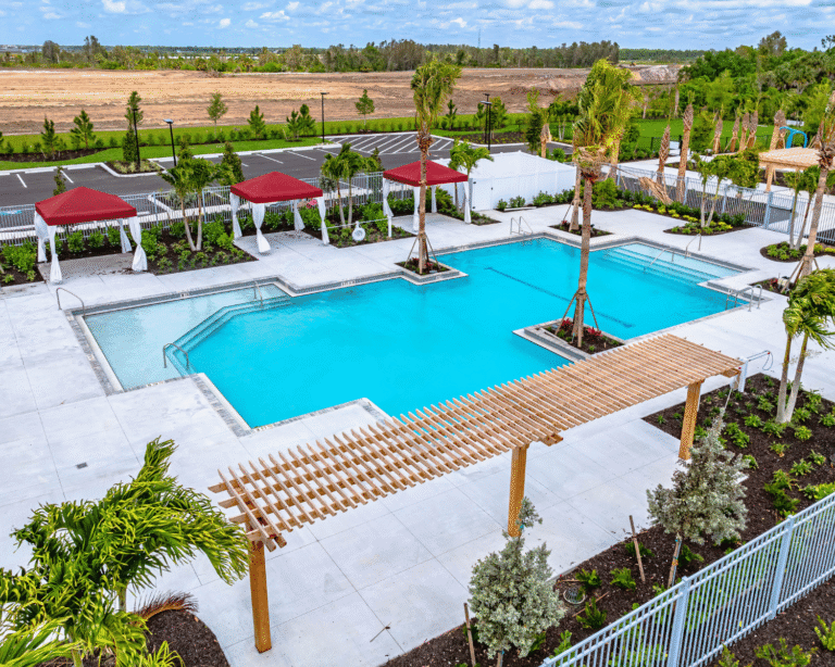 Resort pool with cabanas and pergola at Lakespur at Wellen Park, Venice, Florida