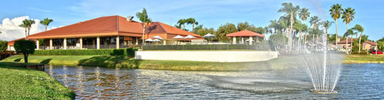 Clubhouse and lake with fountain at Peridia Golf and Country Club, Bradenton, Florida