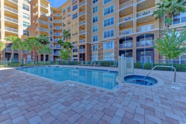 Resort style pool and spa in front of the River Dance condominium building, Bradenton, Florida