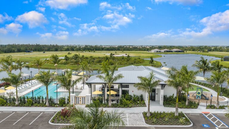 Lakeside amenity center, pool, and lake at Sunstone Lakeside at Wellen Park, Venice, Florida