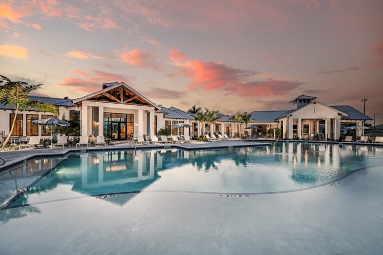Clubhouse and resort pool at dusk at Sweetwater, Lakewood Ranch, Florida