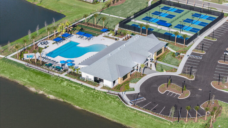 Aerial view of the clubhouse, pool and pickleball courts at Woodland Preserve, Parrish, Florida